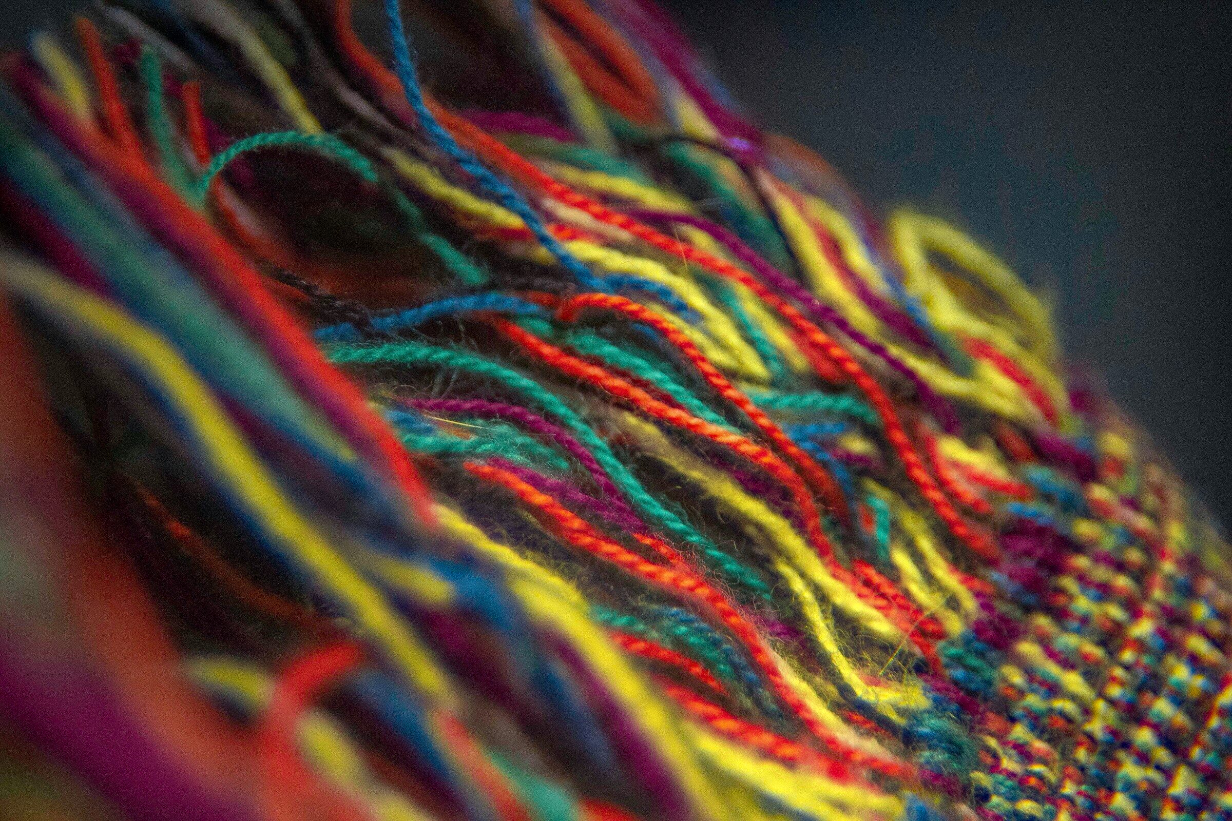 Coloured threads woven together