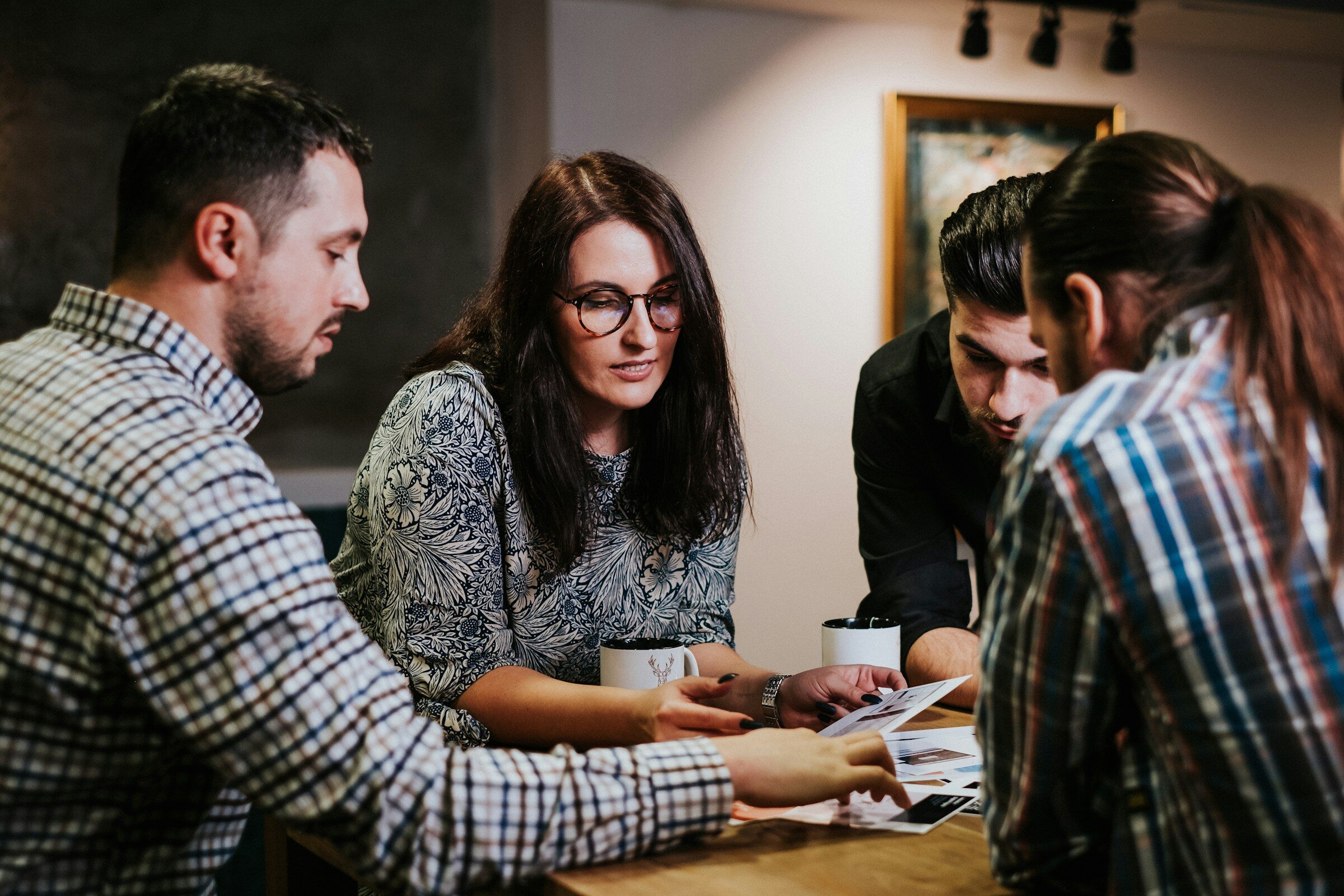A team reviewing documents together at a table